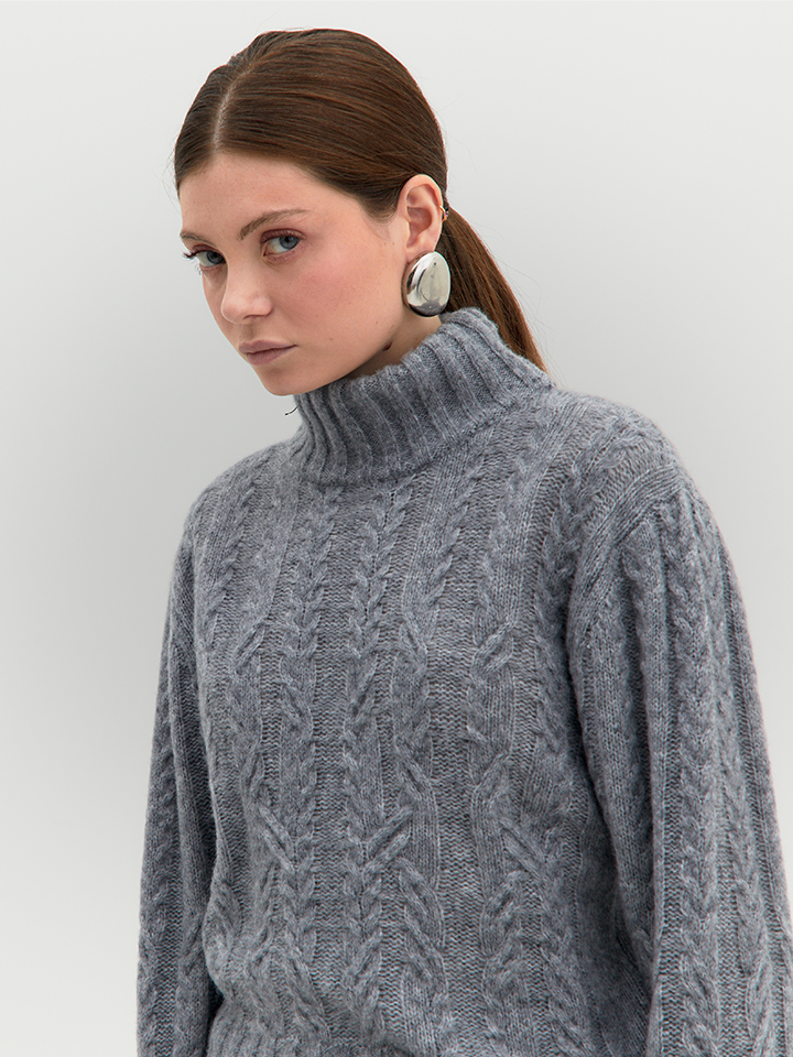 Women’s cable knit turtleneck sweater